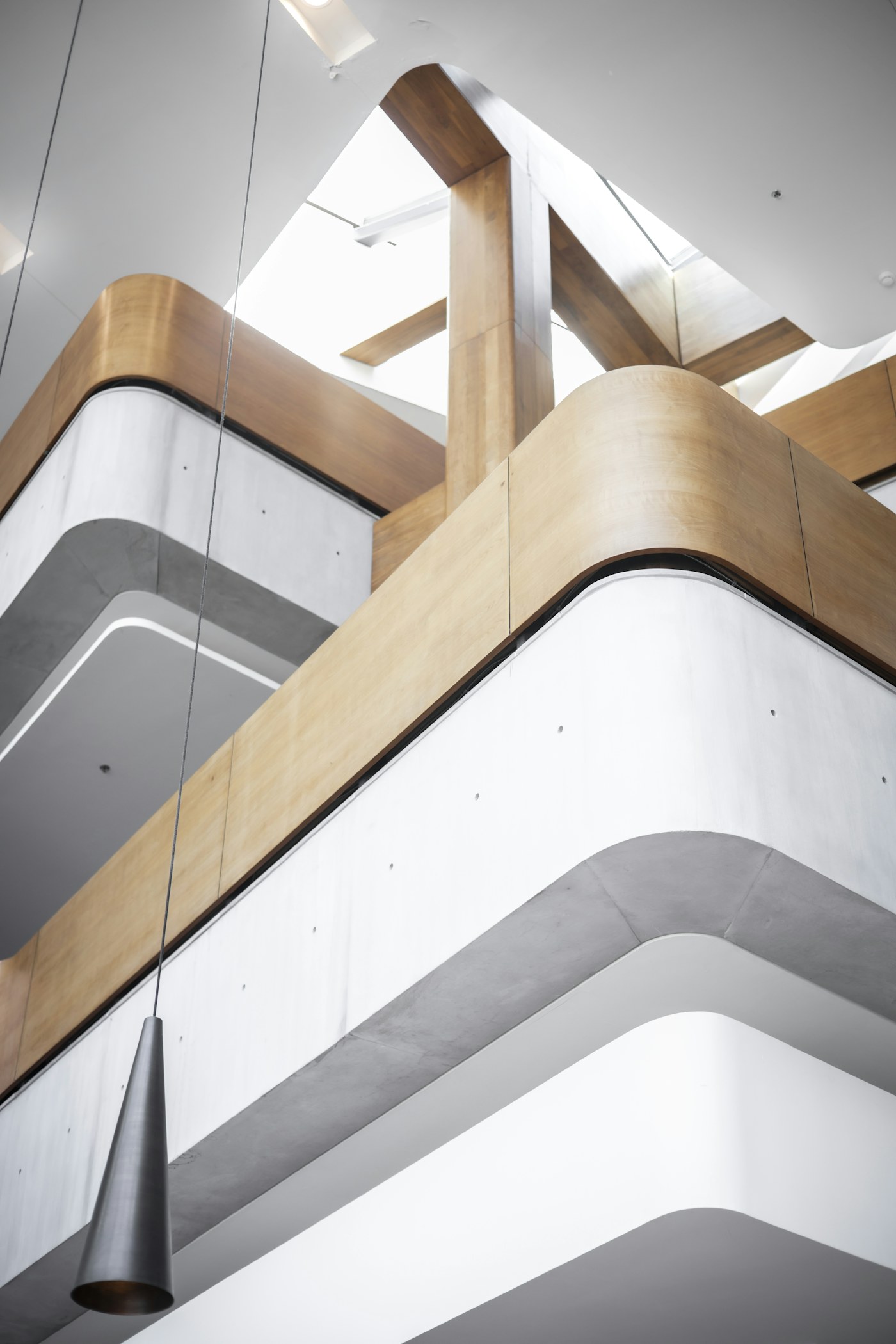 Illustrative interior glass balustrades with light timber handrails