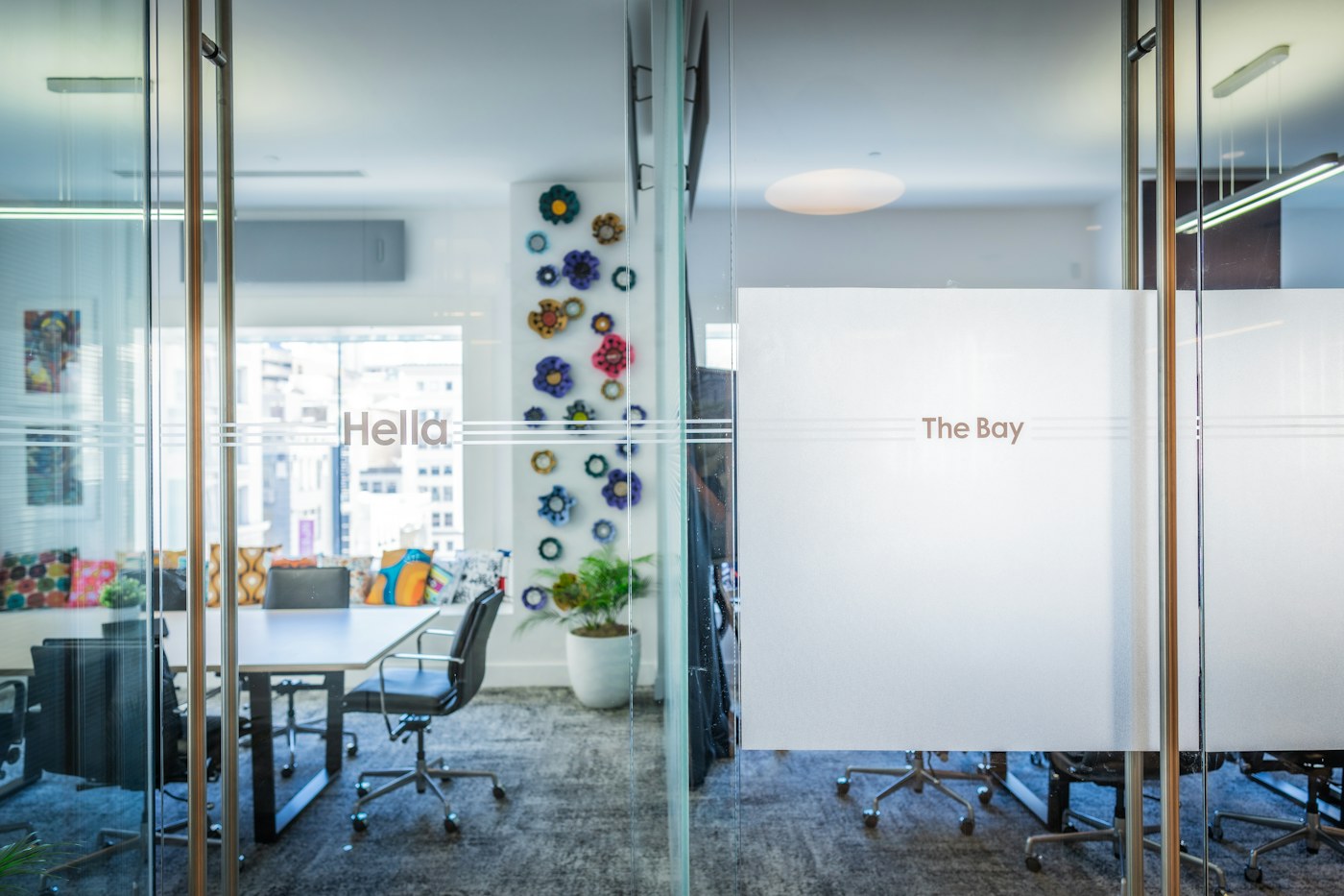 Illustrative office meeting spaces with glass partitions and doors